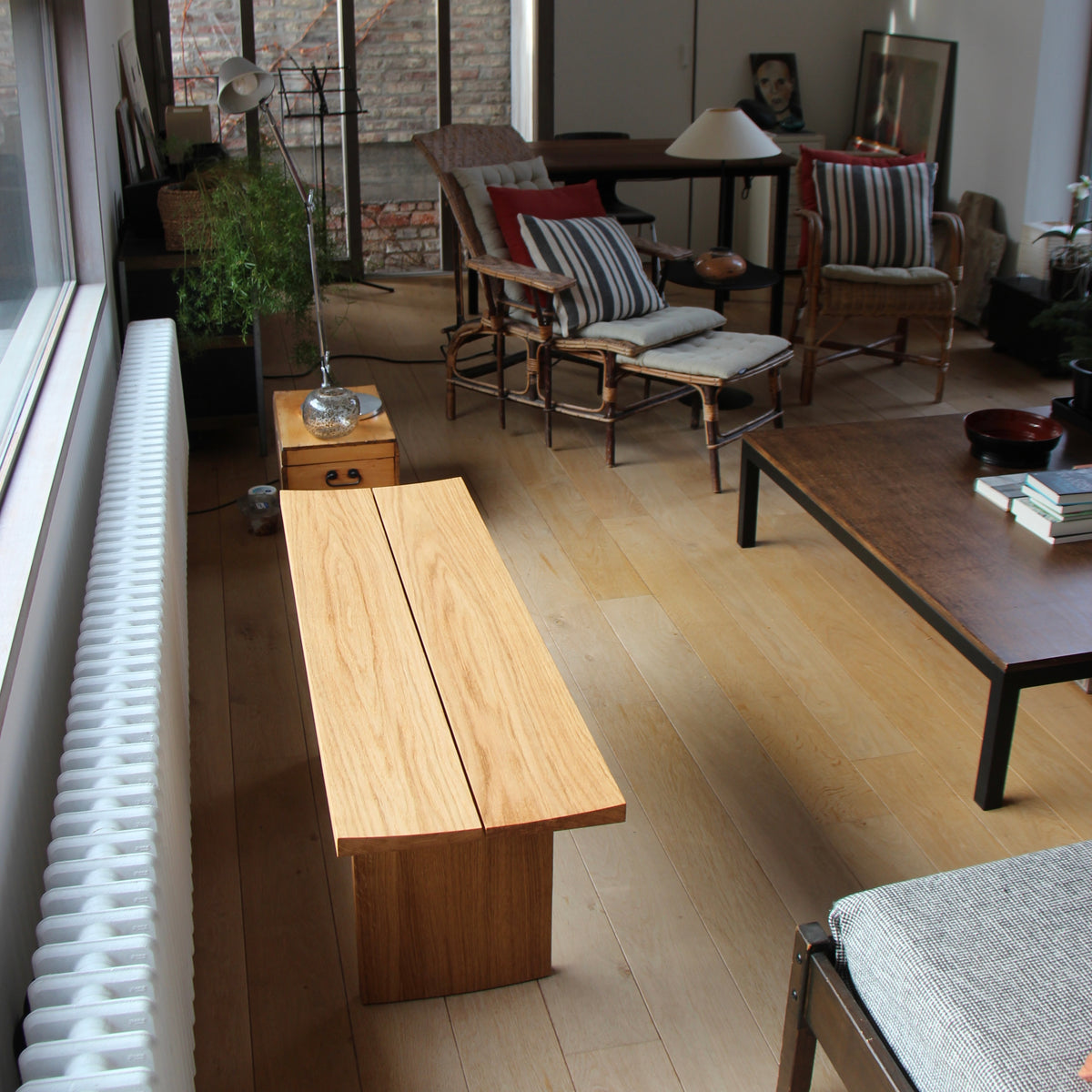 C / C Bench in oak, showing the concave seating surface